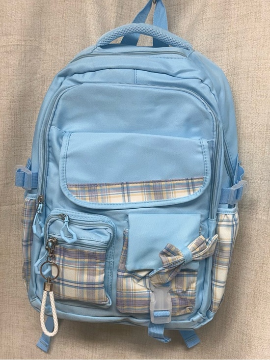 jansport backpack blue plaid Draw Sack Use the front zip pocket for extra storage Light Blue Plaid Stitch Accent